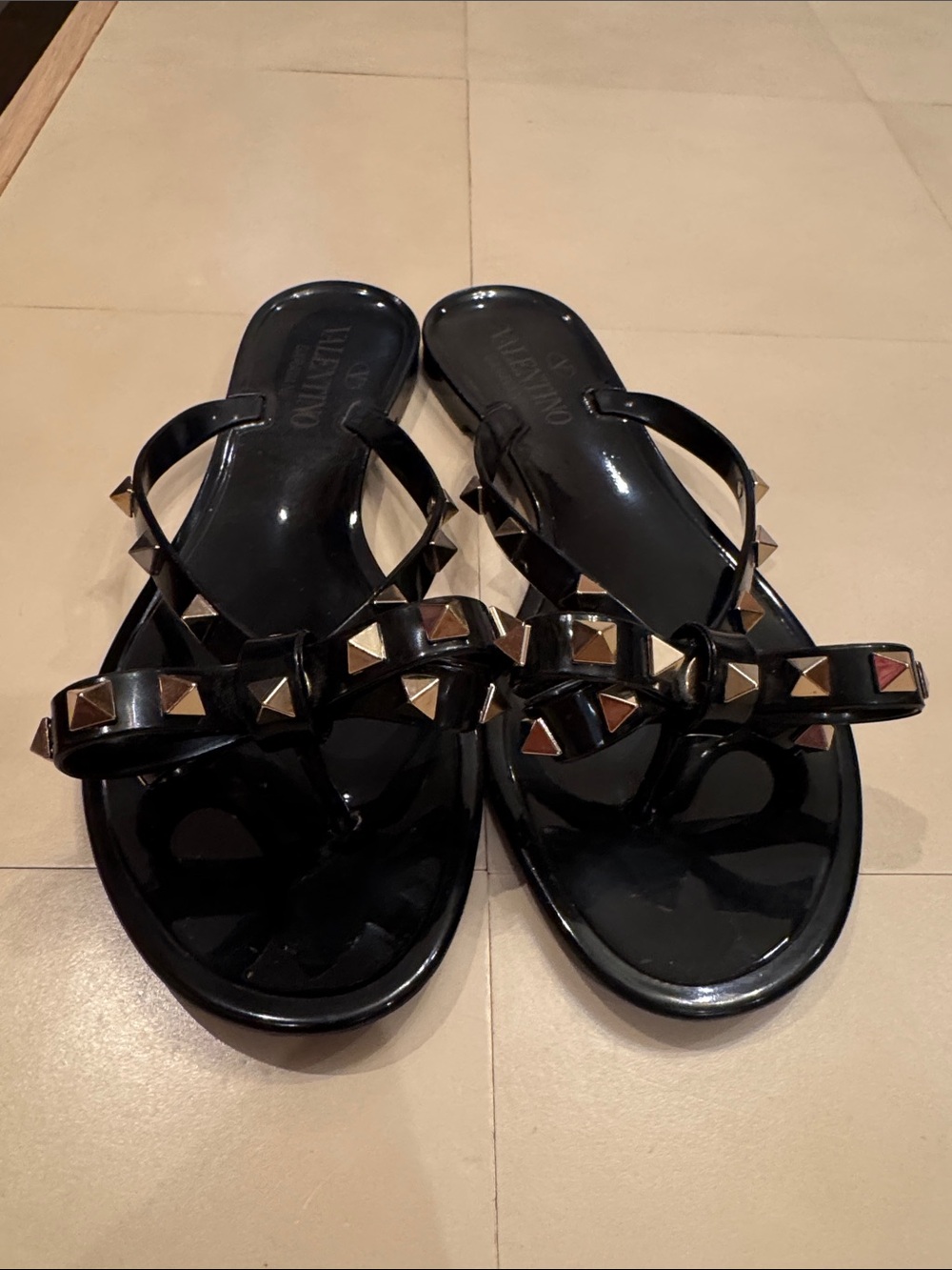 Valentino Garavani Black Jelly Thong Sandals with Gold Pyramid Studs
